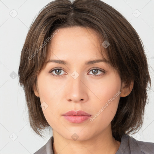 Neutral white young-adult female with medium  brown hair and brown eyes