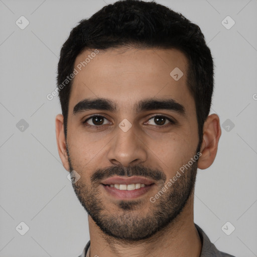 Joyful white young-adult male with short  black hair and brown eyes