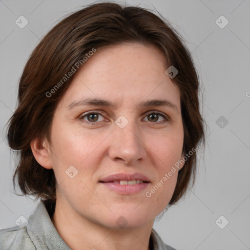 Joyful white adult female with medium  brown hair and grey eyes