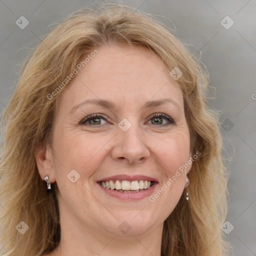 Joyful white adult female with medium  brown hair and blue eyes