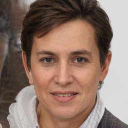 Joyful white adult female with short  brown hair and brown eyes