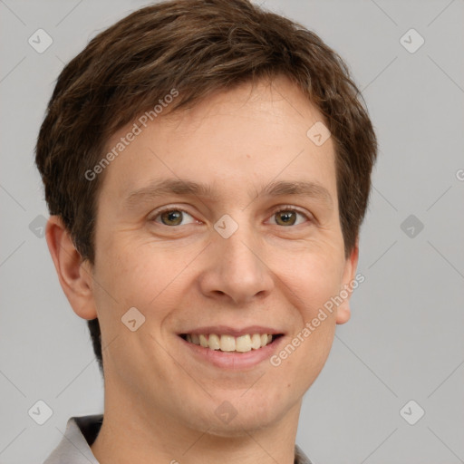 Joyful white adult male with short  brown hair and grey eyes