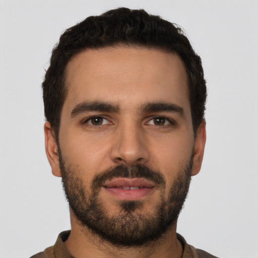 Neutral latino young-adult male with short  black hair and brown eyes