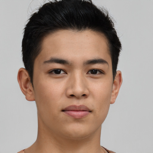 Joyful asian young-adult male with short  brown hair and brown eyes