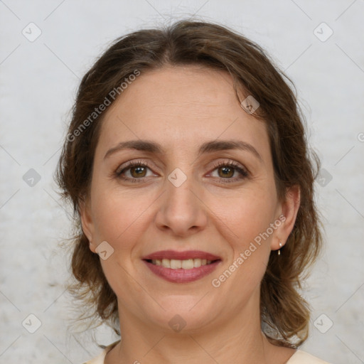 Joyful white young-adult female with medium  brown hair and green eyes