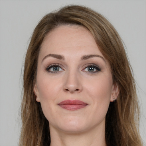 Joyful white young-adult female with long  brown hair and grey eyes