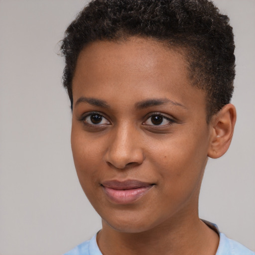 Joyful black young-adult female with short  brown hair and brown eyes