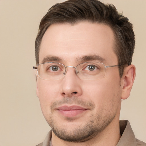 Joyful white young-adult male with short  brown hair and brown eyes