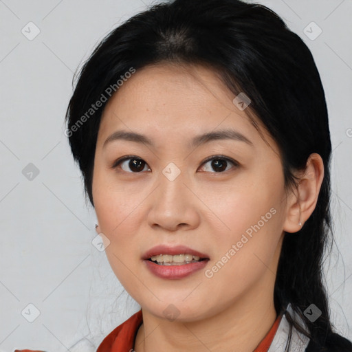 Joyful asian young-adult female with medium  black hair and brown eyes