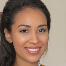 Joyful latino young-adult female with long  brown hair and brown eyes