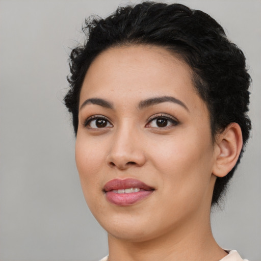 Joyful latino young-adult female with medium  black hair and brown eyes