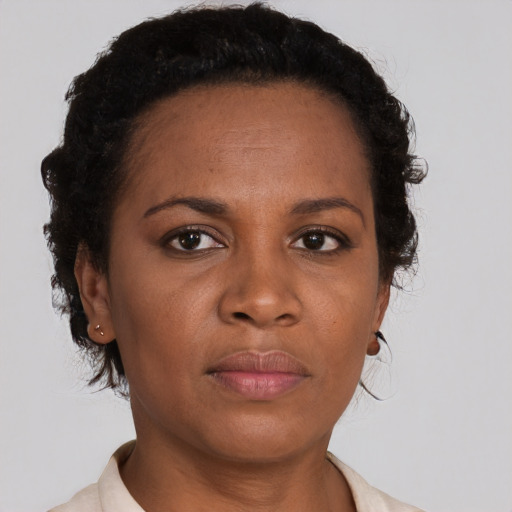 Neutral black young-adult female with short  brown hair and brown eyes