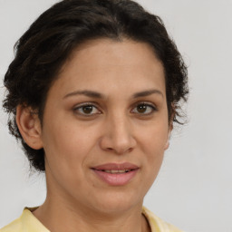 Joyful white adult female with short  brown hair and brown eyes