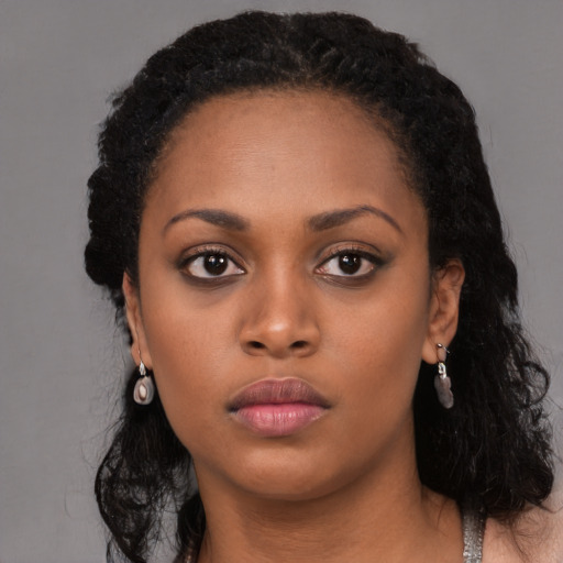 Neutral black young-adult female with long  black hair and brown eyes