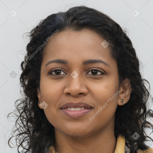 Joyful black young-adult female with long  brown hair and brown eyes