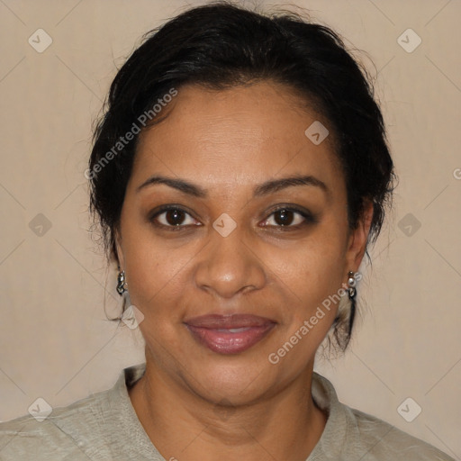 Joyful black adult female with medium  brown hair and brown eyes