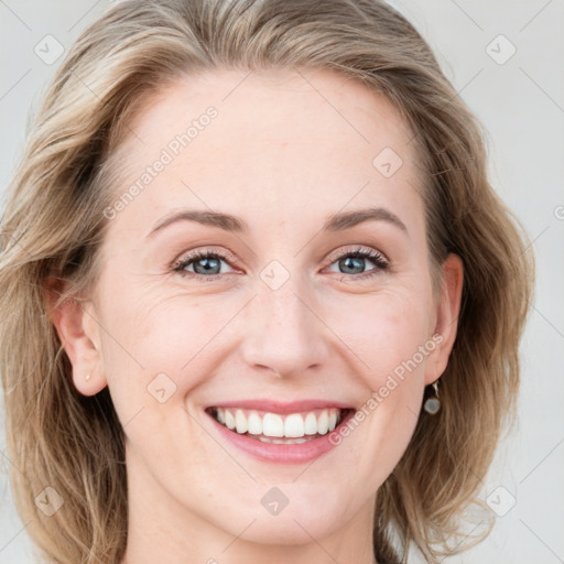 Joyful white young-adult female with medium  brown hair and blue eyes