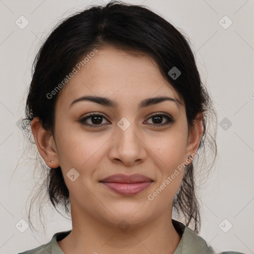 Joyful latino young-adult female with medium  brown hair and brown eyes