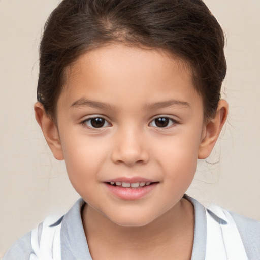 Joyful white child female with short  brown hair and brown eyes