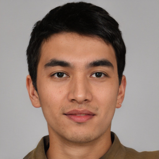 Joyful asian young-adult male with short  black hair and brown eyes