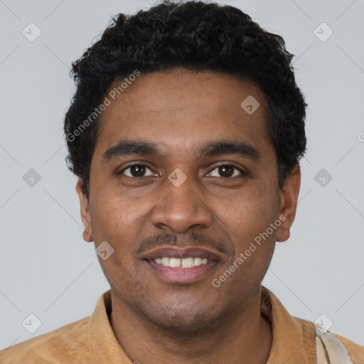 Joyful black young-adult male with short  black hair and brown eyes