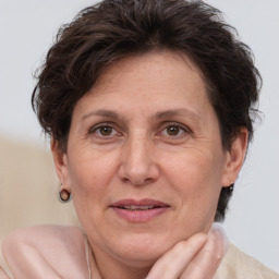 Joyful white adult female with short  brown hair and brown eyes