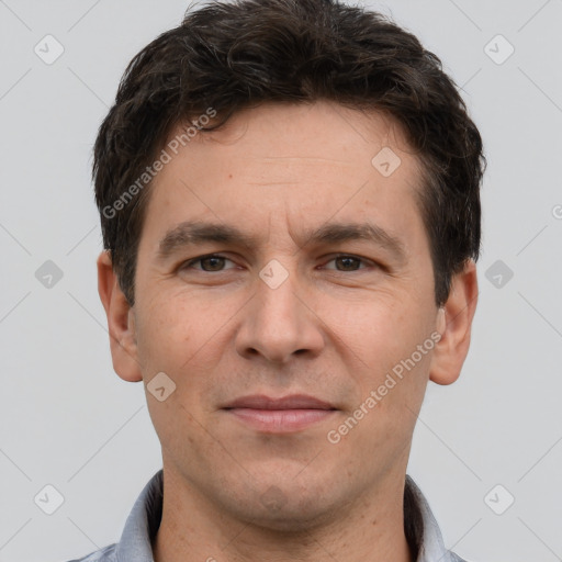 Joyful white adult male with short  brown hair and brown eyes