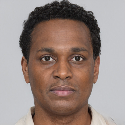 Neutral black young-adult male with short  brown hair and brown eyes