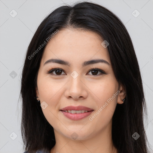 Joyful latino young-adult female with long  brown hair and brown eyes