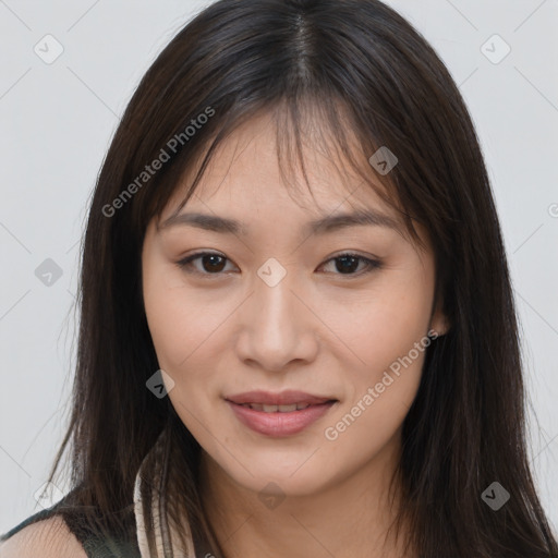 Joyful asian young-adult female with long  brown hair and brown eyes