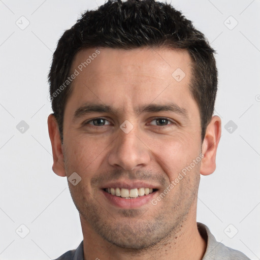 Joyful white young-adult male with short  brown hair and brown eyes