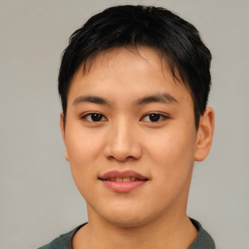 Joyful asian young-adult female with short  black hair and brown eyes