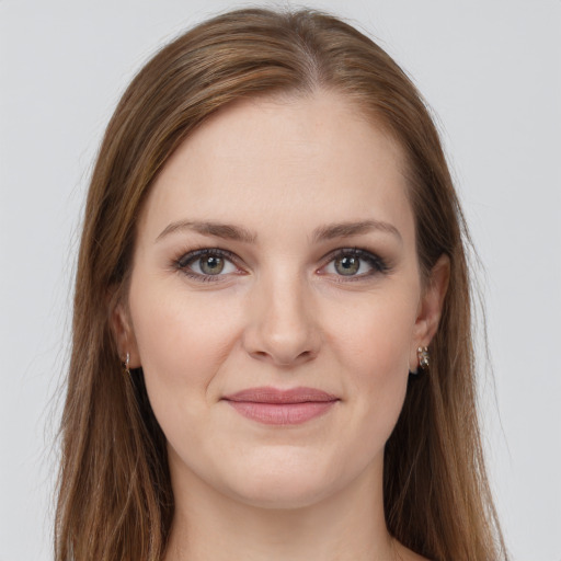 Joyful white young-adult female with long  brown hair and grey eyes