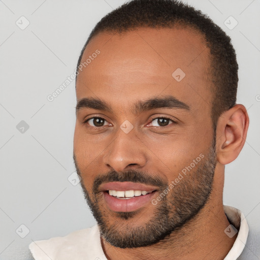 Joyful white young-adult male with short  black hair and brown eyes