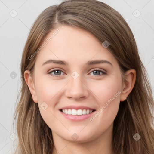 Joyful white young-adult female with long  brown hair and grey eyes