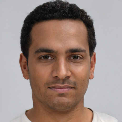 Neutral black young-adult male with short  brown hair and brown eyes
