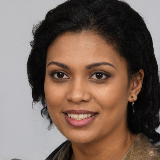 Joyful latino young-adult female with medium  black hair and brown eyes