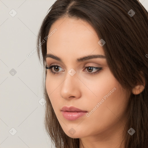 Neutral white young-adult female with long  brown hair and brown eyes