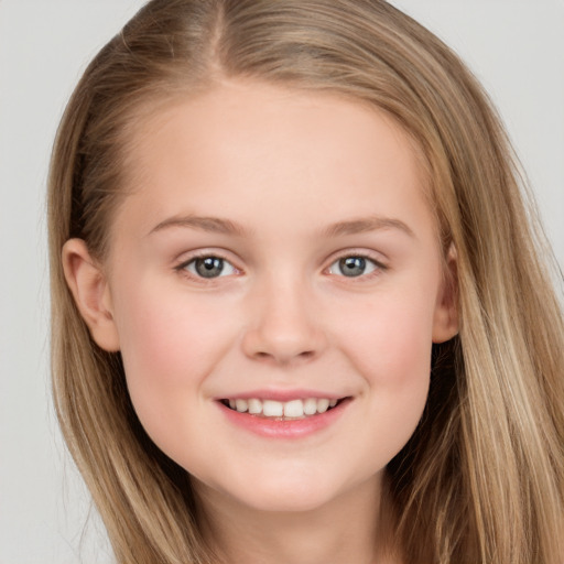 Joyful white child female with long  brown hair and brown eyes