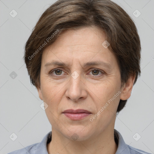 Joyful white adult female with short  brown hair and grey eyes