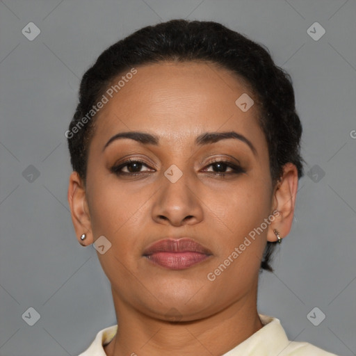 Joyful latino young-adult female with short  brown hair and brown eyes