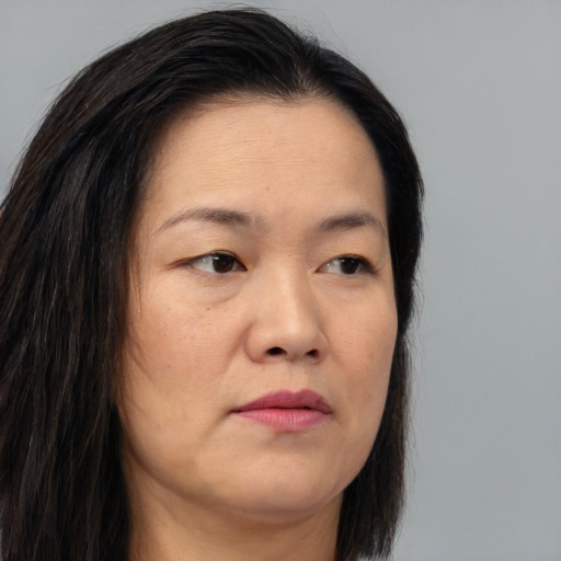Neutral asian young-adult female with long  brown hair and brown eyes