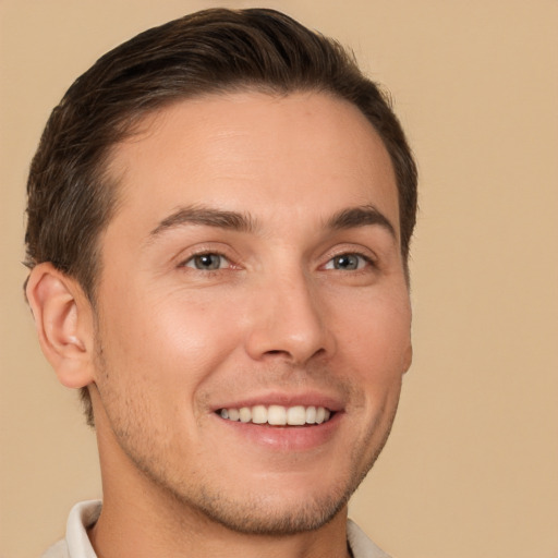 Joyful white young-adult male with short  brown hair and brown eyes