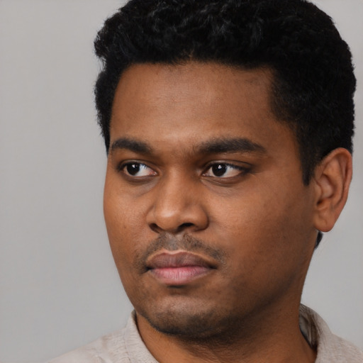 Neutral black young-adult male with short  black hair and brown eyes