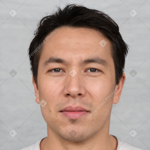 Joyful white adult male with short  brown hair and brown eyes