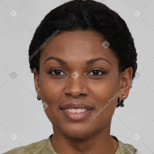 Joyful black young-adult female with short  black hair and brown eyes