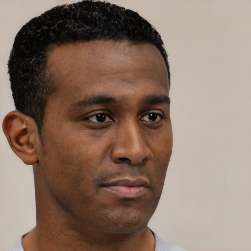 Neutral black young-adult male with short  black hair and brown eyes