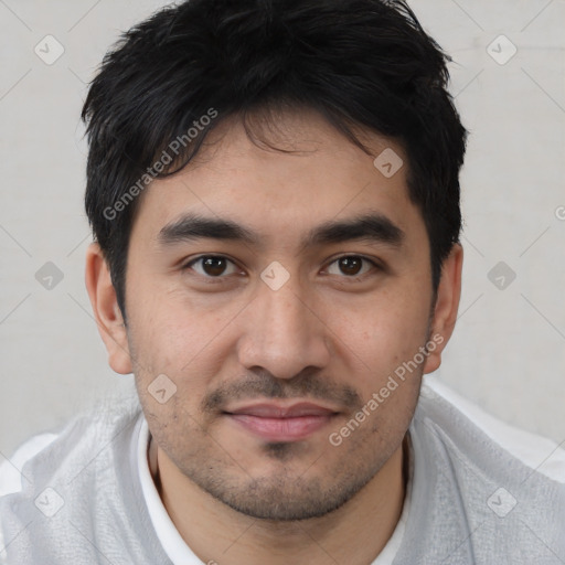 Joyful white young-adult male with short  black hair and brown eyes