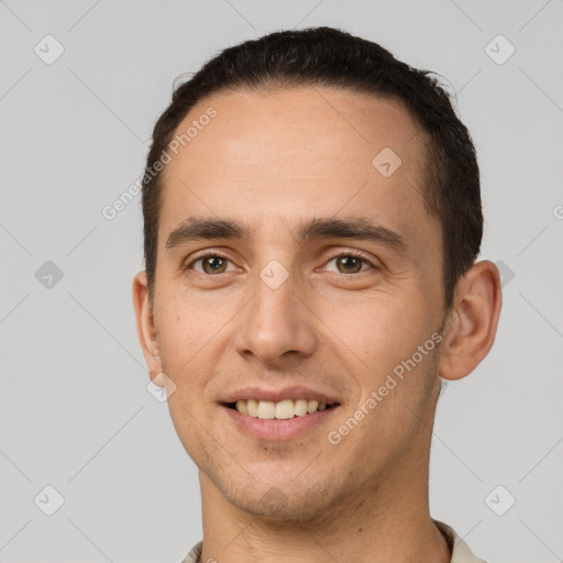 Joyful white young-adult male with short  brown hair and brown eyes