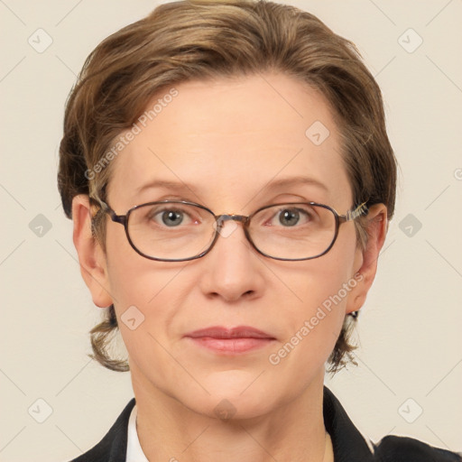 Joyful white adult female with short  brown hair and grey eyes